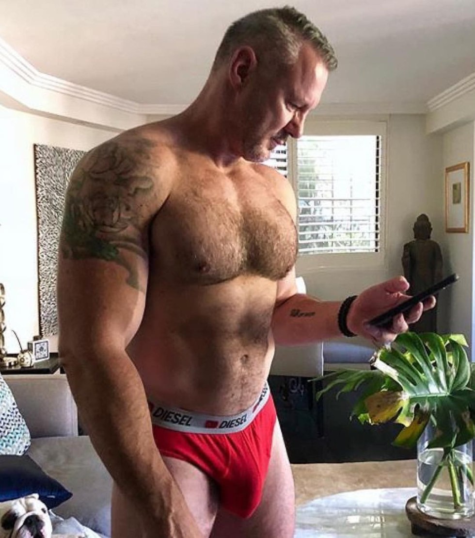 Beautiful naked guy squat