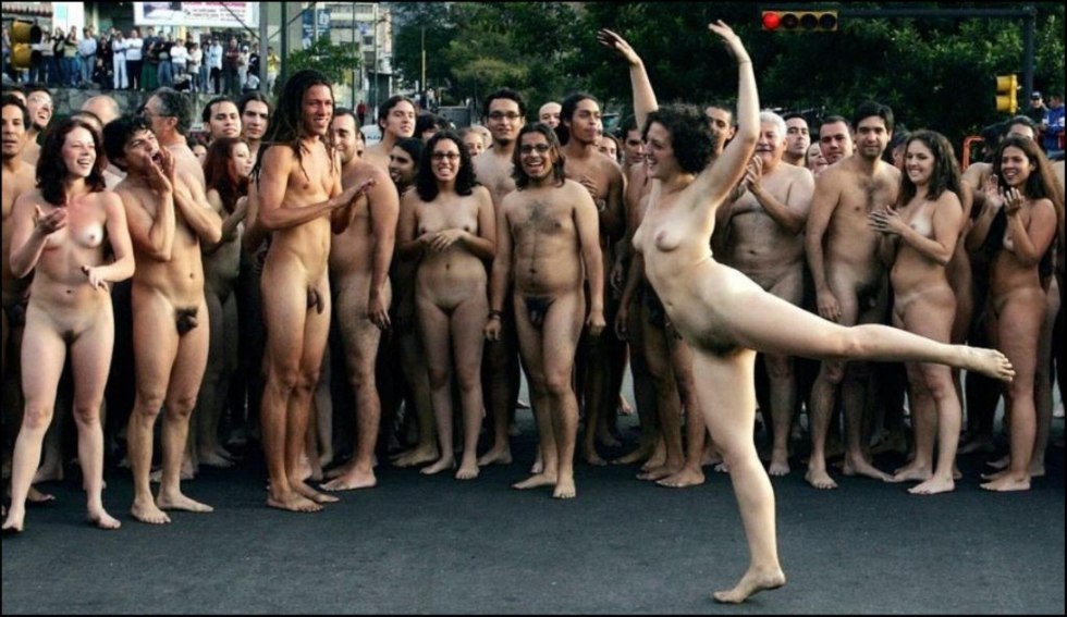 Naked chick in front of the crowd at the factory workers