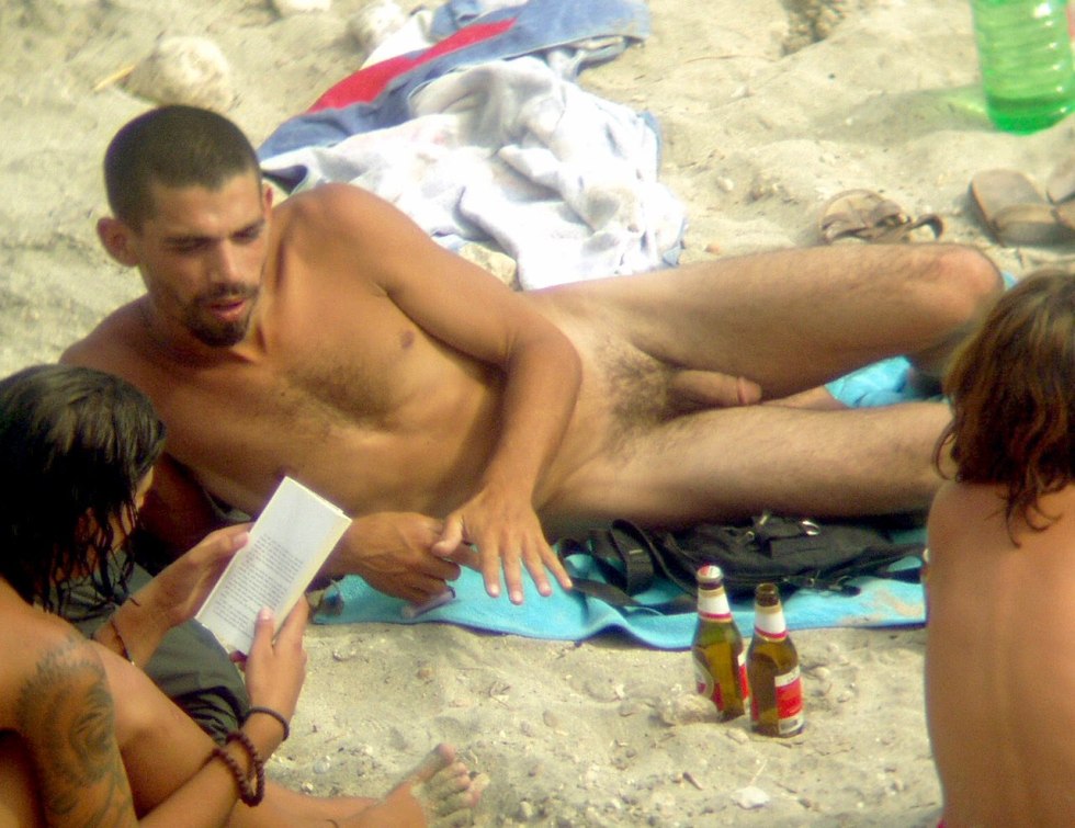 Guys and girls on a nudist beach