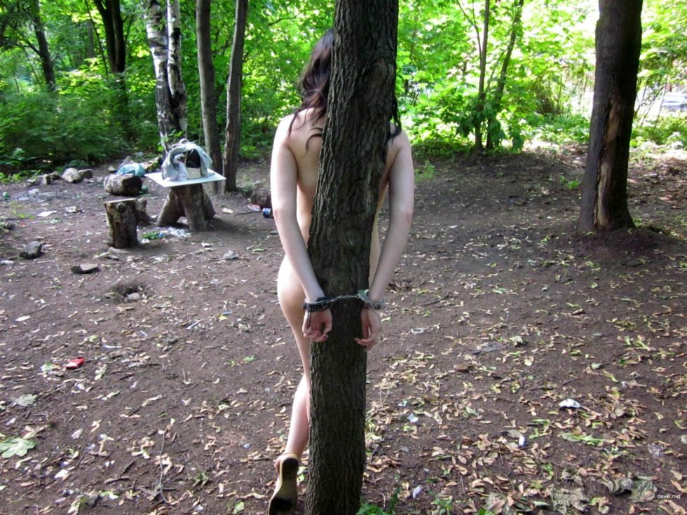 Naked men and women in the forest