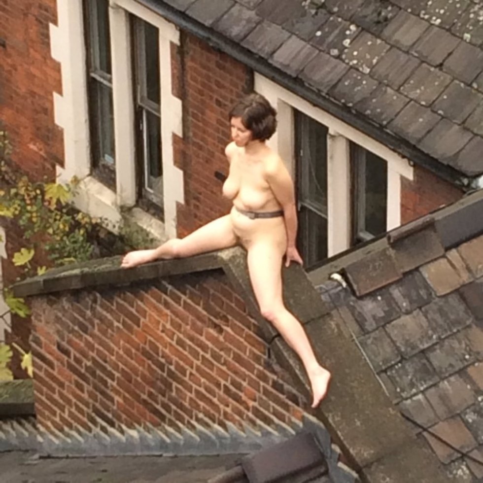 Sunbathes naked on the roof