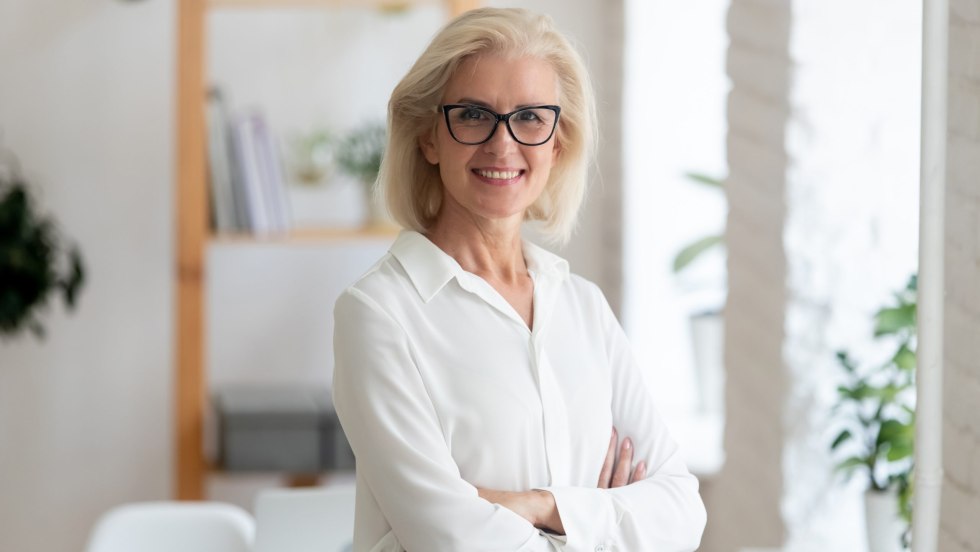 Successful elderly woman with glasses REAL