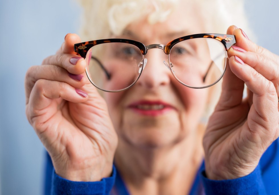 Old woman with glasses in the office