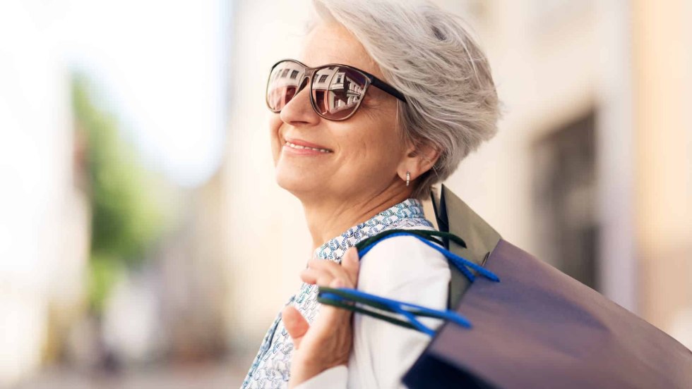 An elderly woman smiles