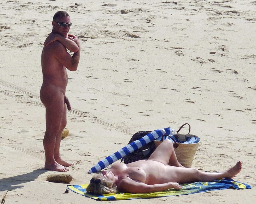 Naked pairs with an erection on the beach
