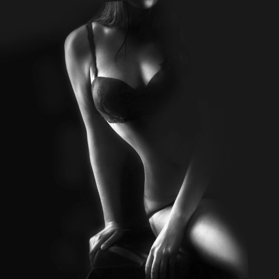 Women's body on a black background