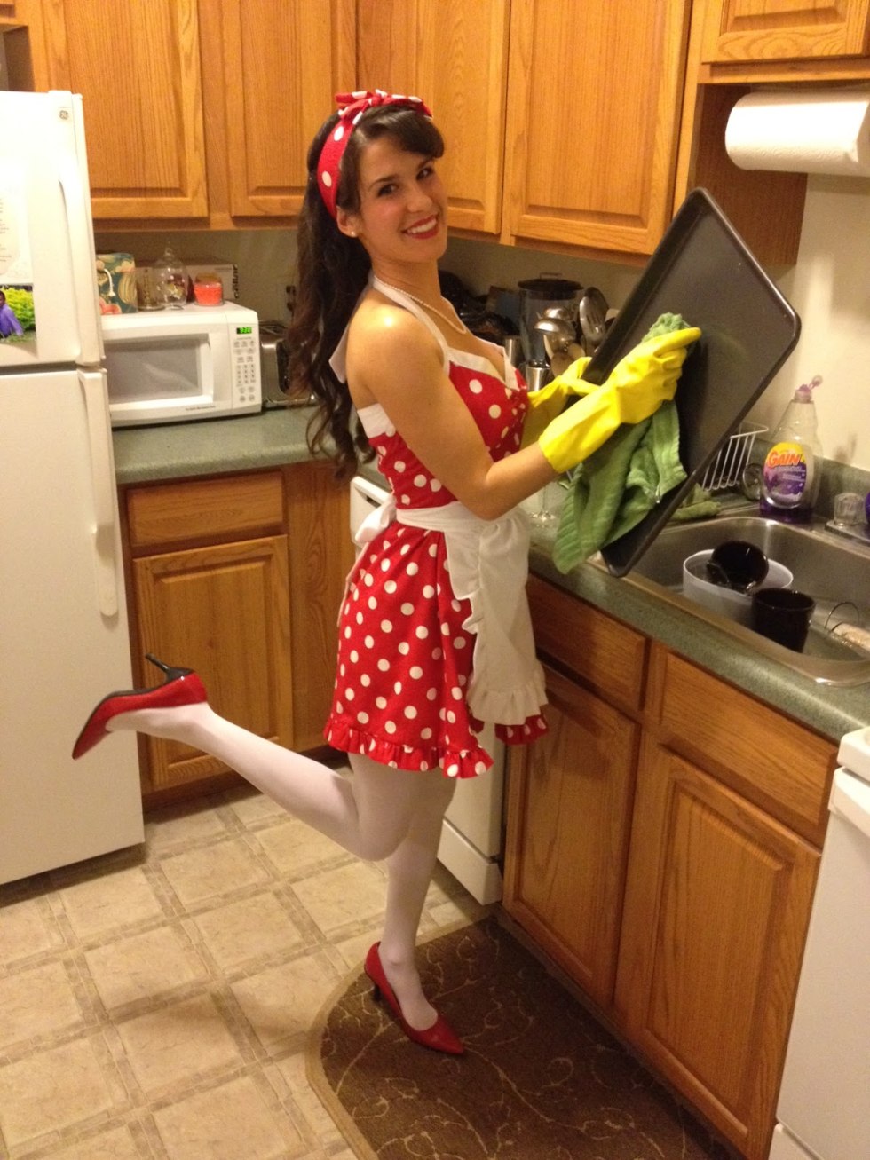 A woman in a apron sits