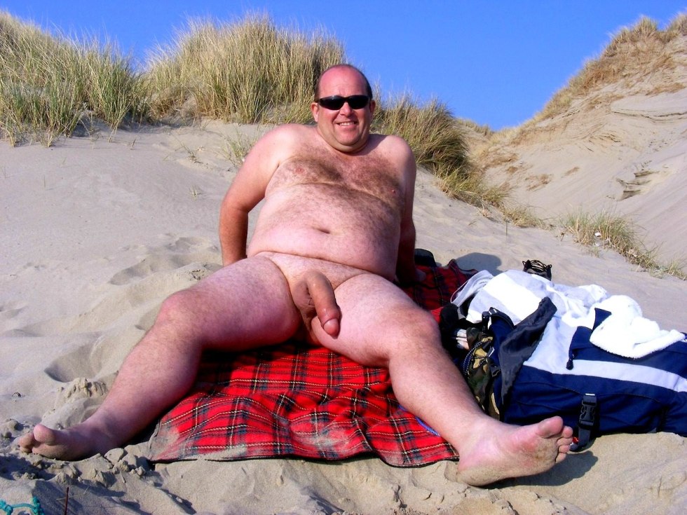 Naked men pumped on the beach