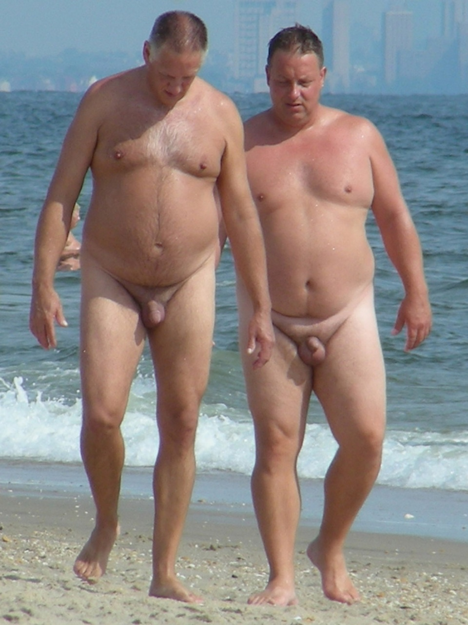 Naked fat men on the beach