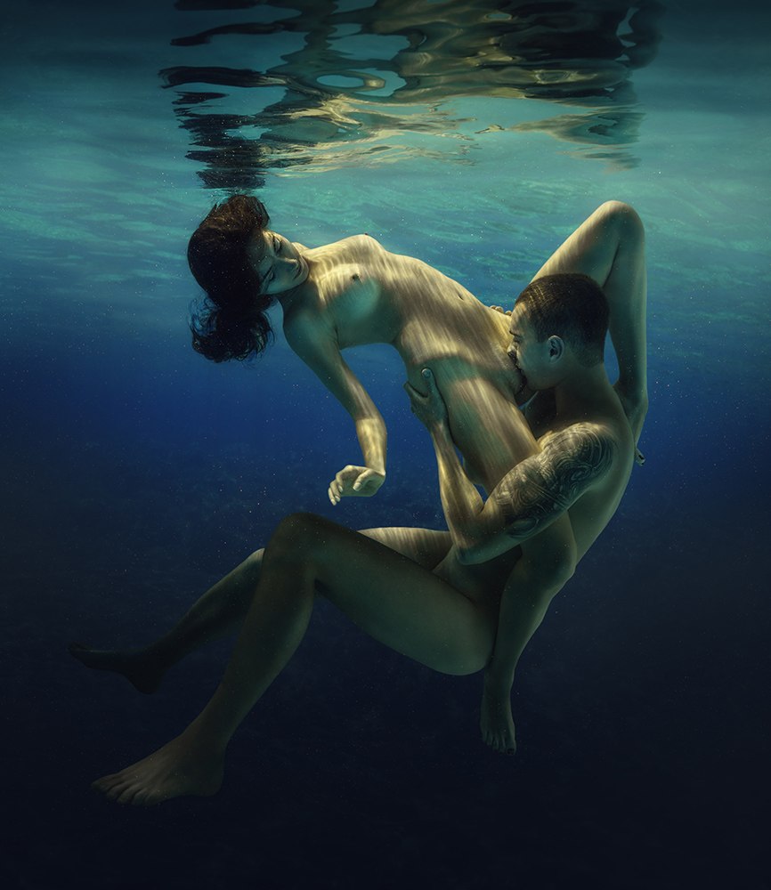 Naked man and woman in water