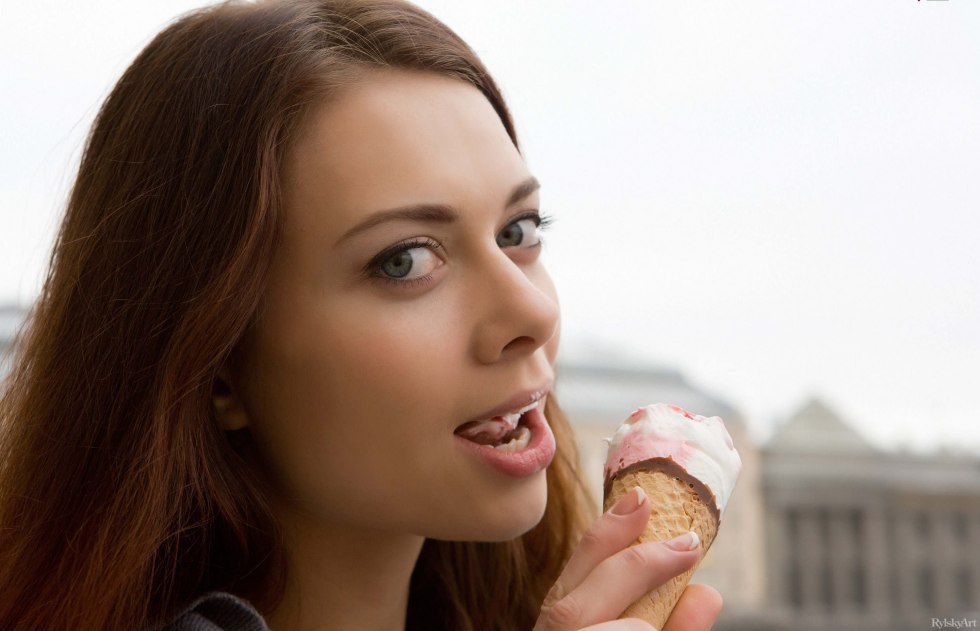 Ice cream on the lips of a girl