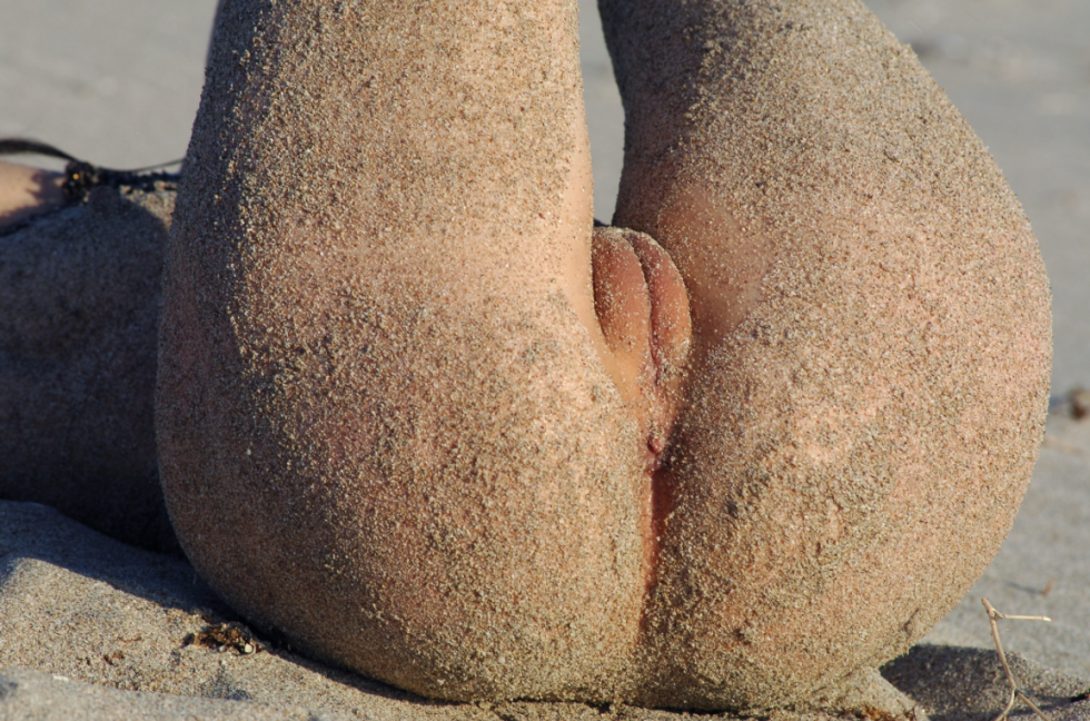 Vagina woman in the sand