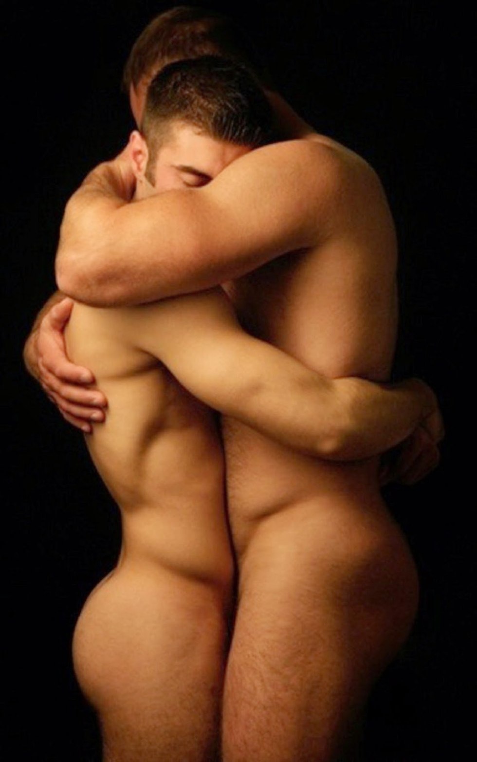 Naked men hug