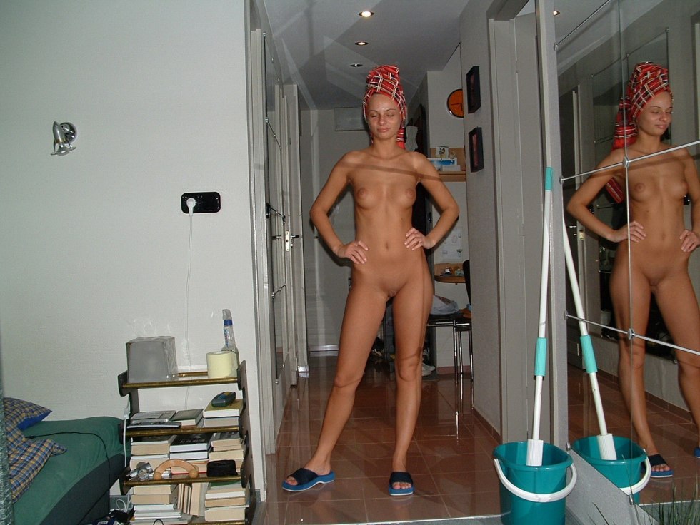 Naked woman walks around the apartment
