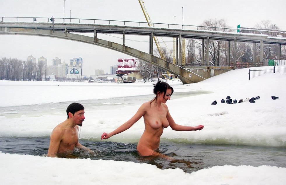 Naked women in winter in the hole