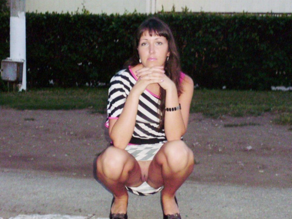 Women in shorts squatted private