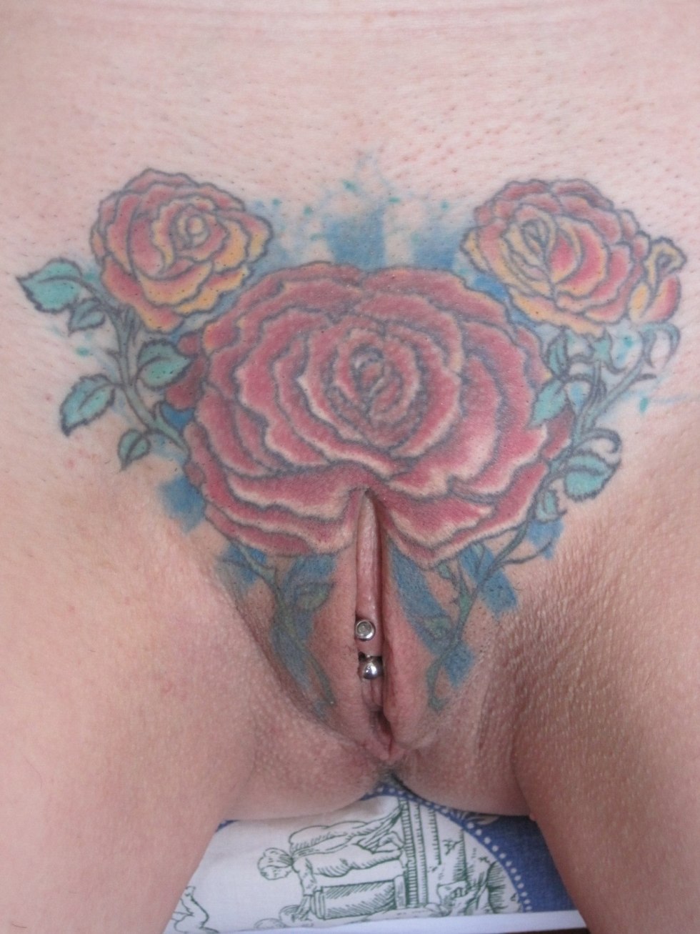 Beautiful tattoo on female pubis