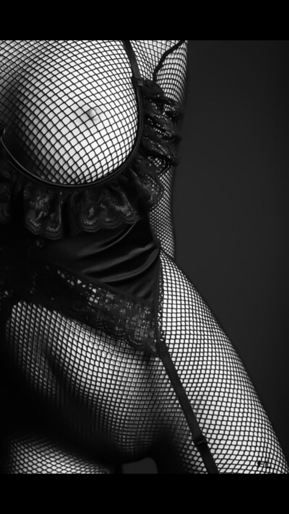 Girl in an erotic mesh