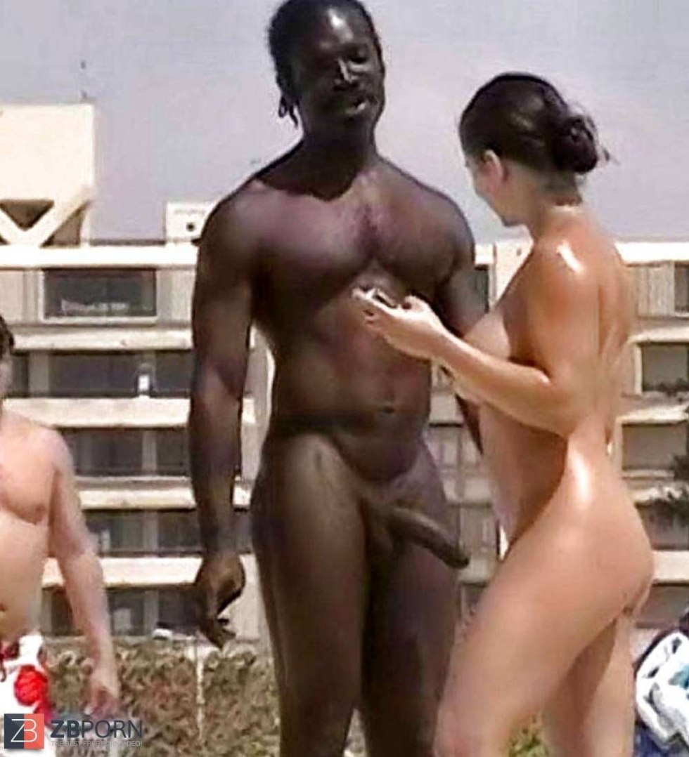 Naked Negro with a woman on the beach