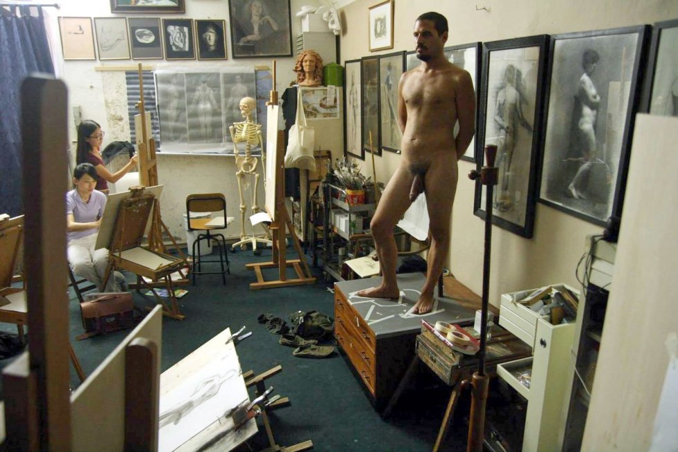 A naked man poses artists