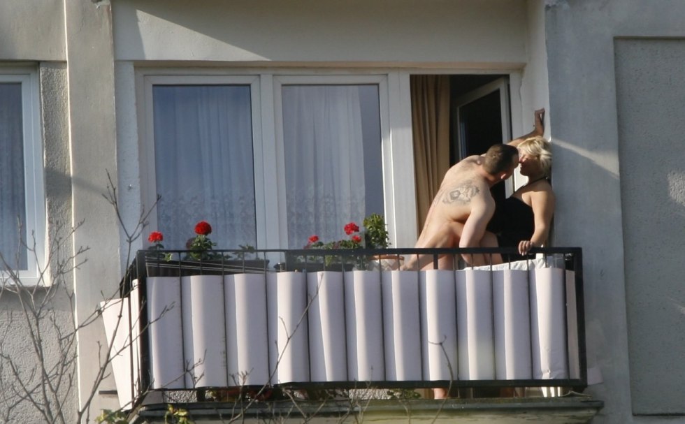 Naked on the balcony spied