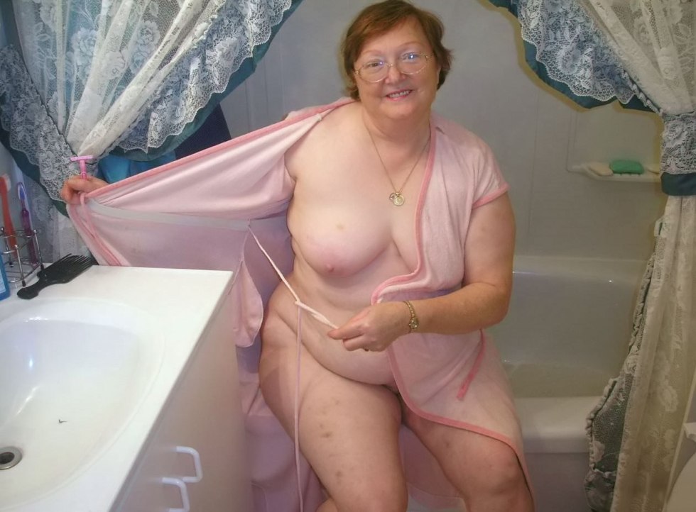 Naked fat old woman in a dressing room