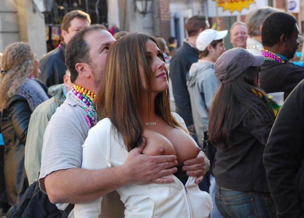 The girl shows her breasts in public
