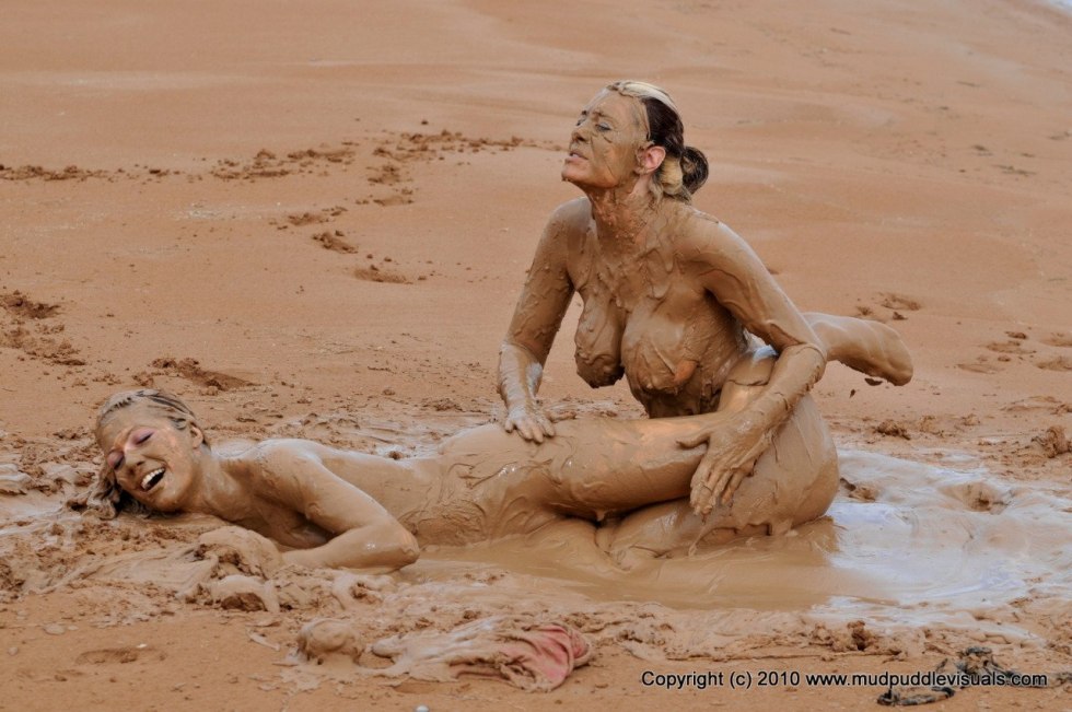 Naked women drown in mud