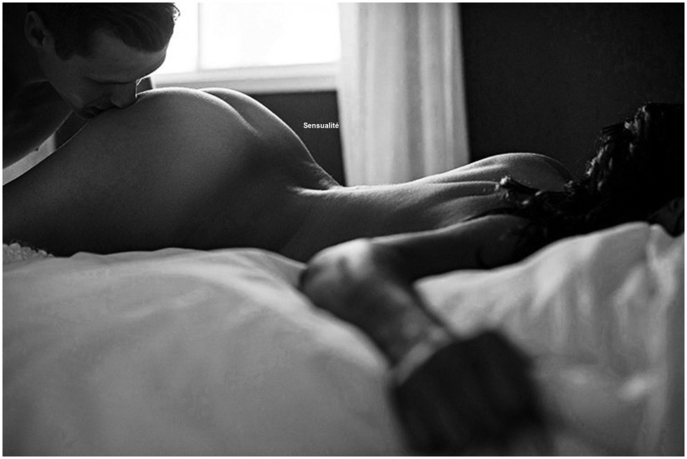 The guy kisses the girl in the ass