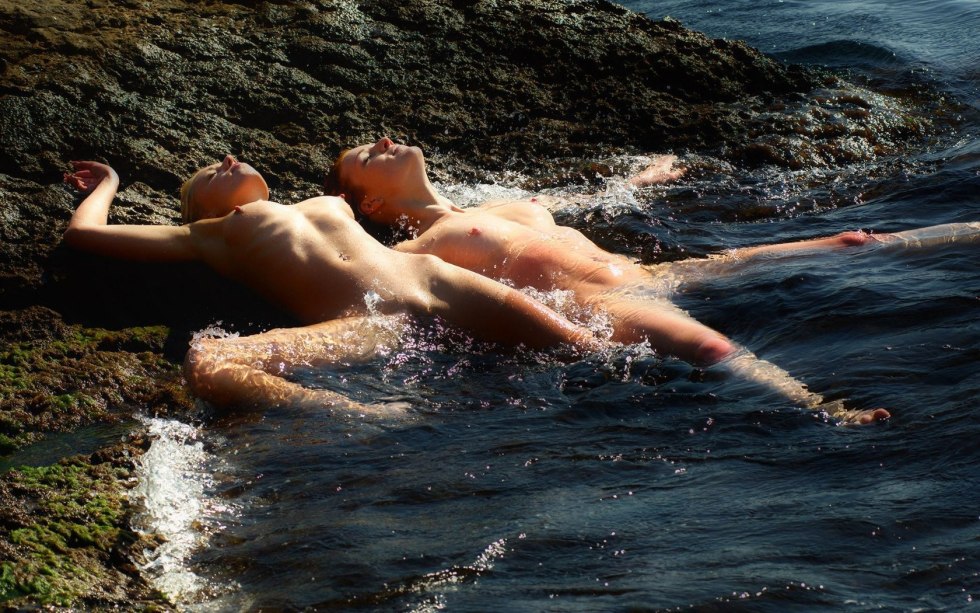 Naked women at sea in water