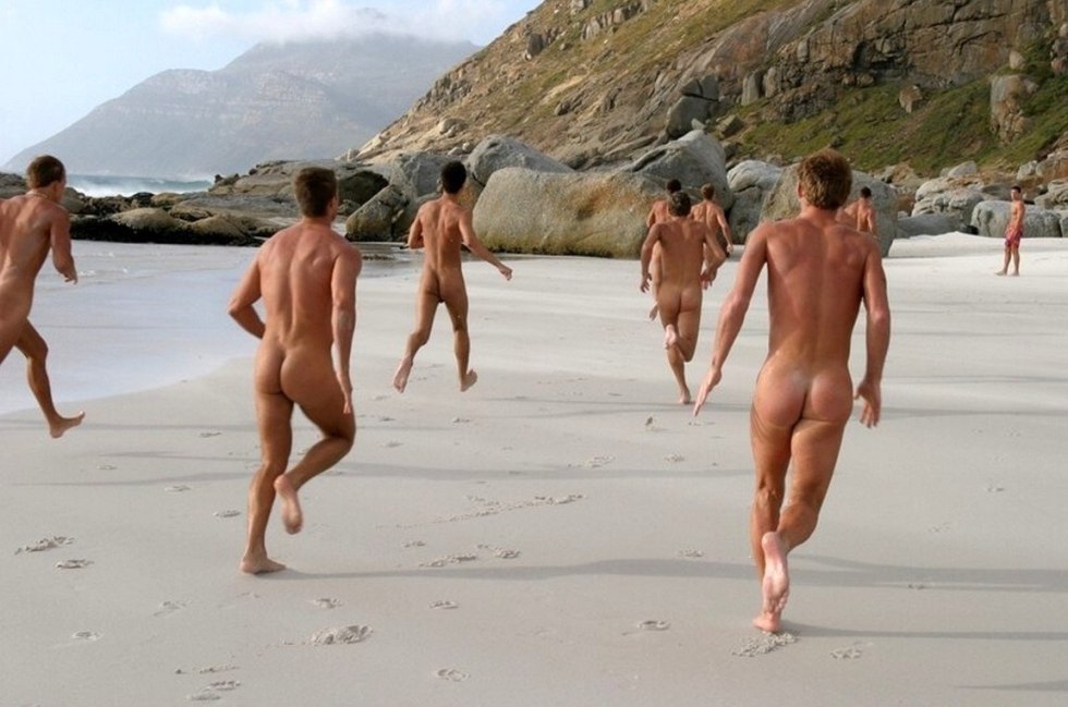 A crowd of naked guys on the beach