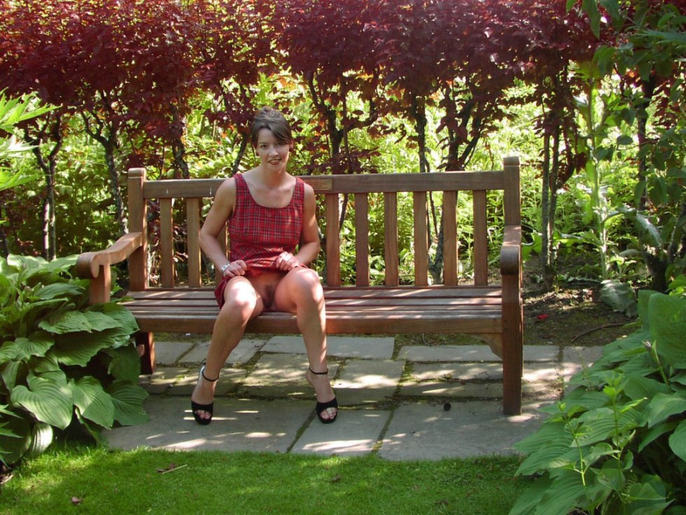 Mature on a bench without panties