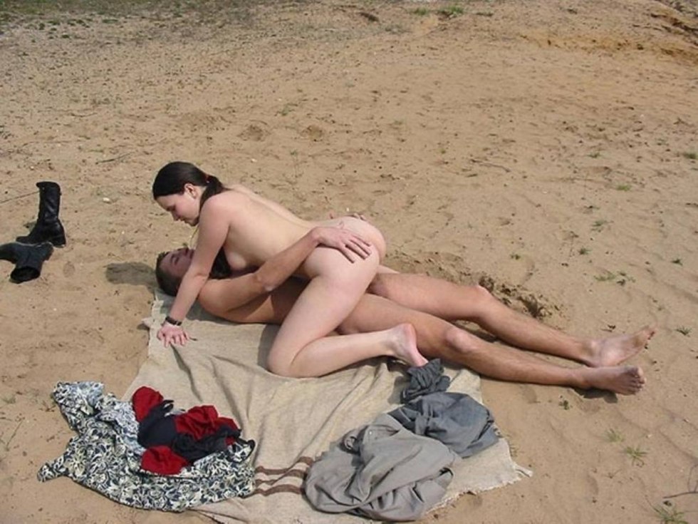 Naked exhibitionists on the beach