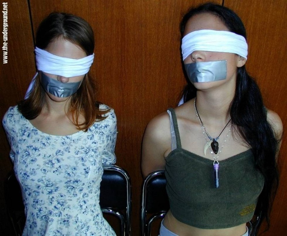 Related girls with a glued mouth with tape