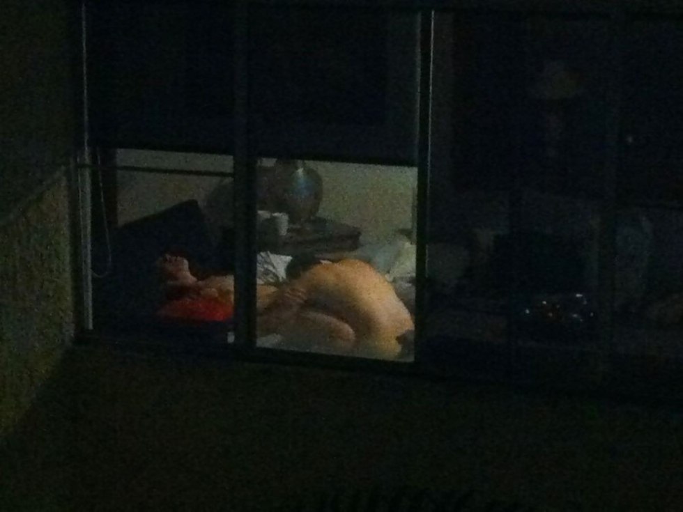 Naked woman in the window opposite