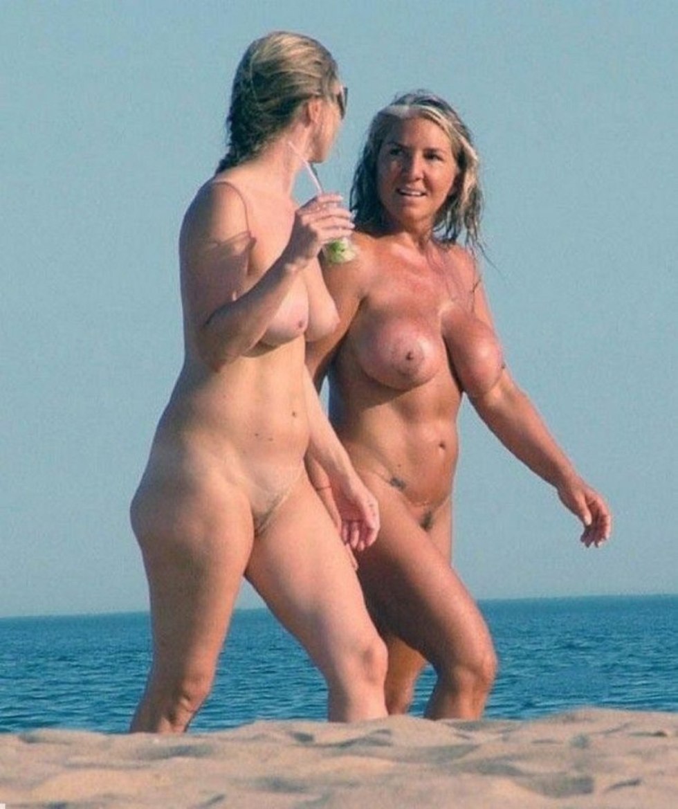 Naked women with daughters on the beach