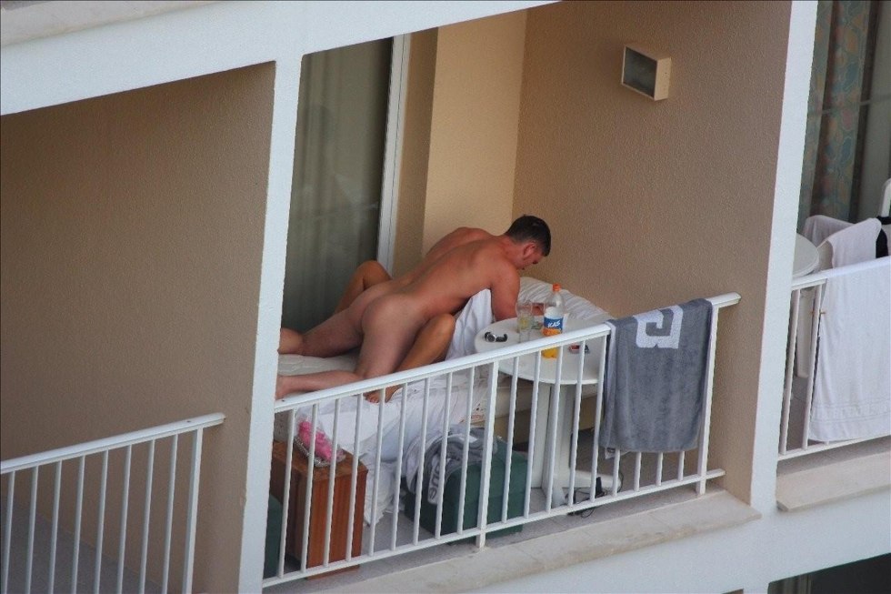 Naked on the balcony spied
