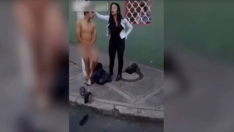 Forced to undress on the street