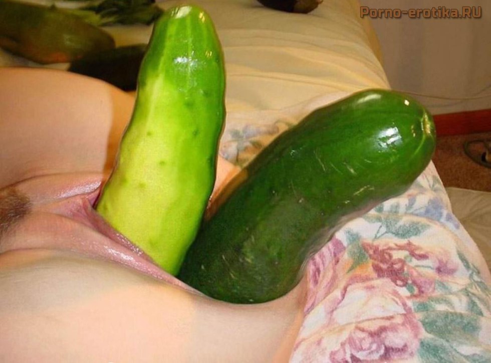 Huge cucumber in the pussy