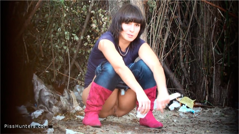 The girl crouched in the bushes