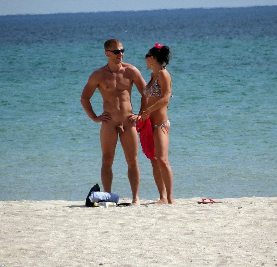 Naked guy on a public beach