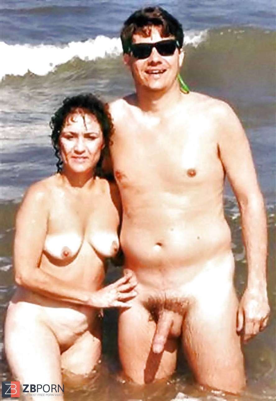Naked pairs with an erection on the beach