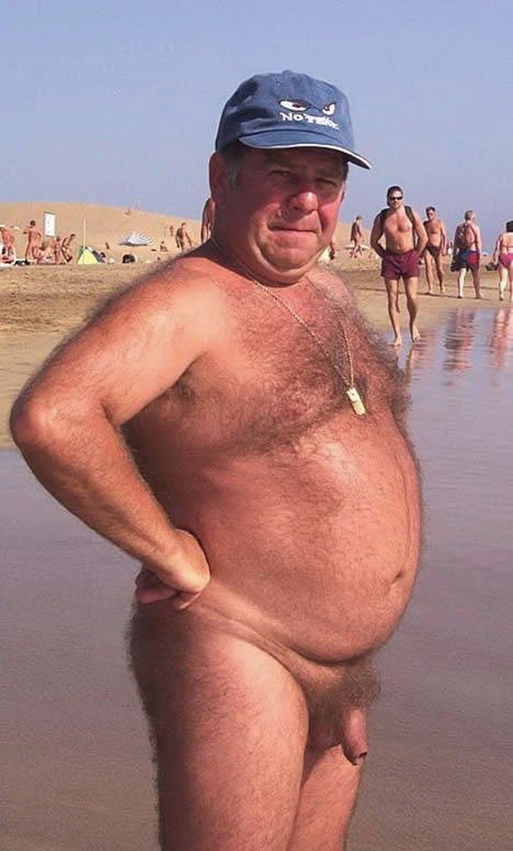 Naked fat man on the beach