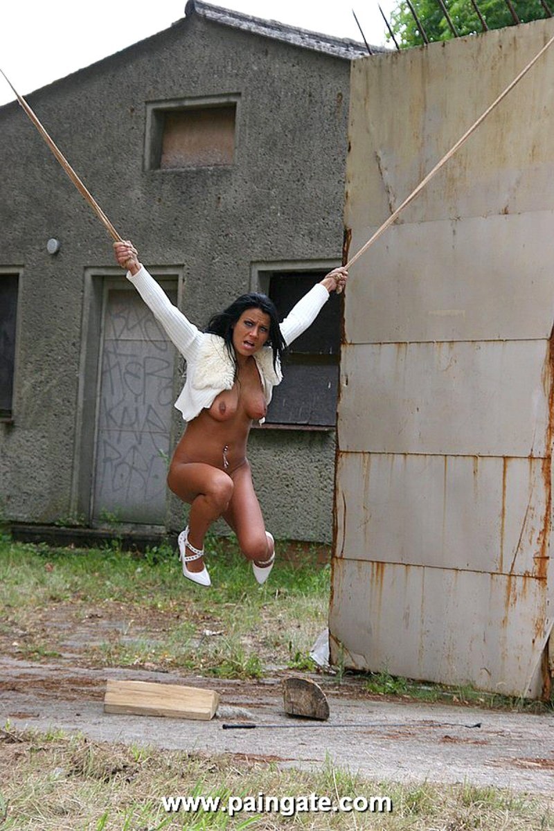 Tied naked to a pillar on the street