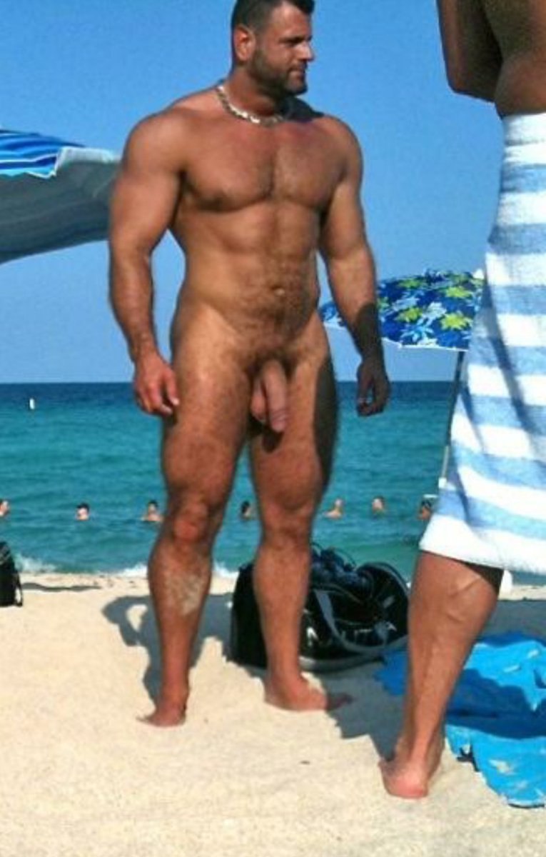 A man with a huge member on the beach