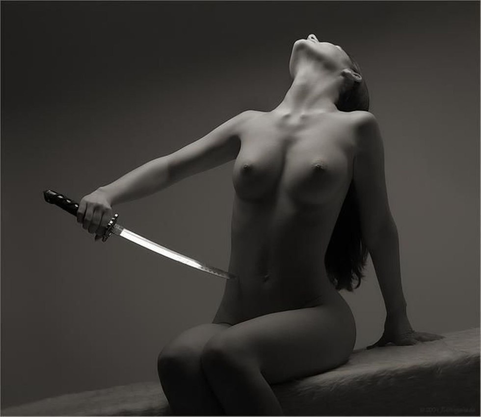Naked woman with a dagger