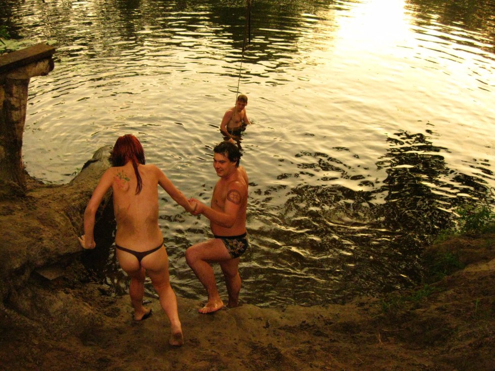 Friends naked on the river