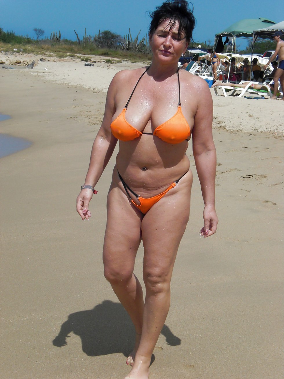 Mature women in swimsuits on the beach