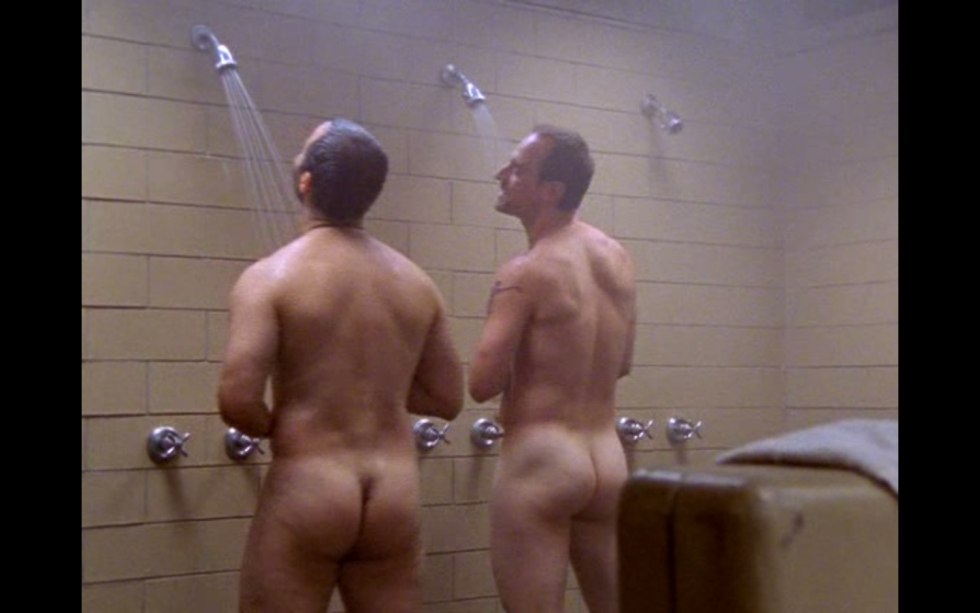 Naked men wash in the bath