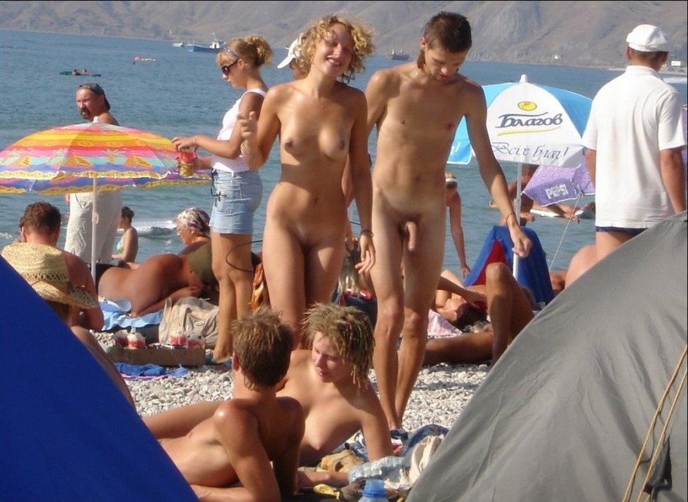 Naked men and women on the beach